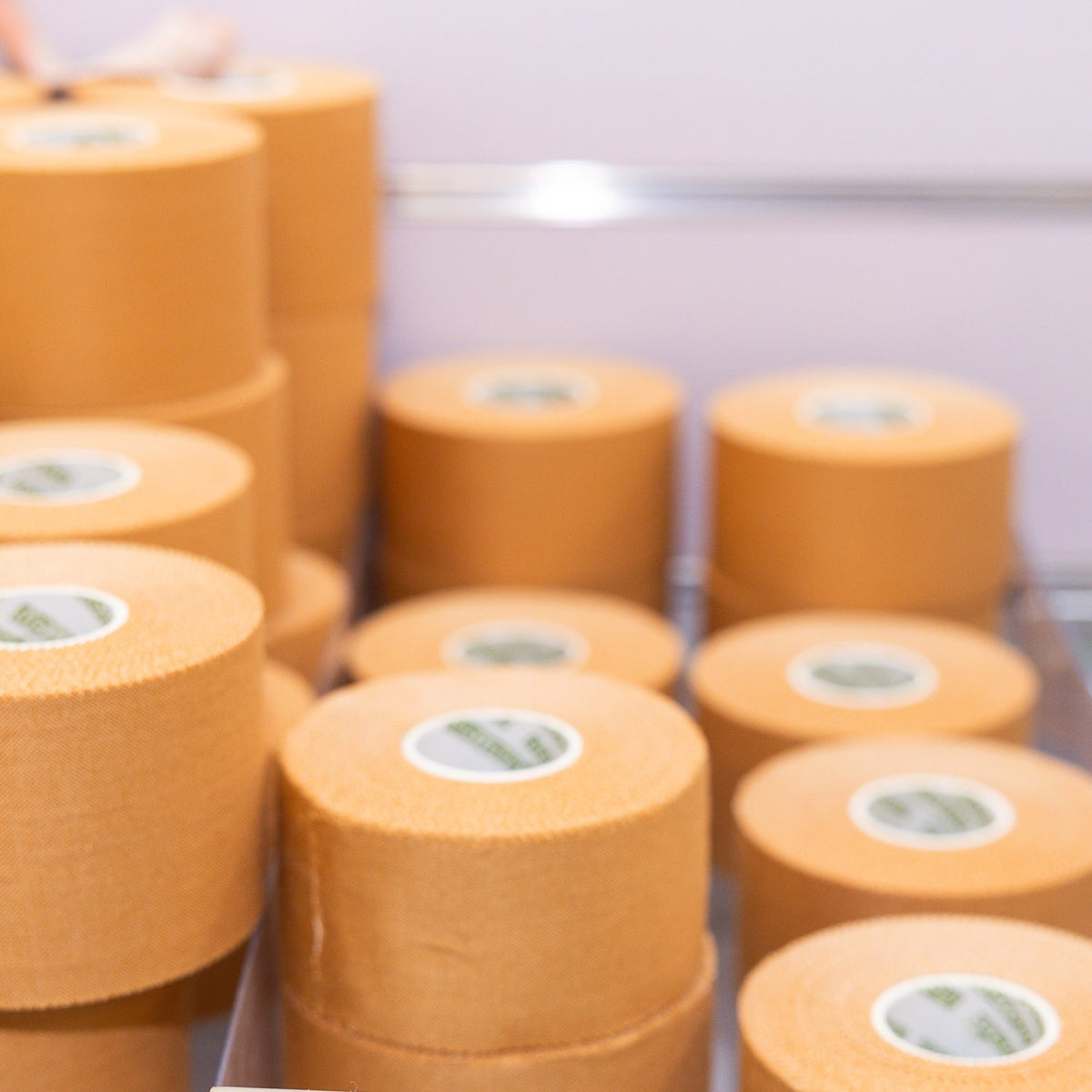 Rolls of Straptor rigid strapping tape stacked on the East Bendigo store shelf
